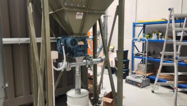 Soil remediation baghouse with carbon dosing